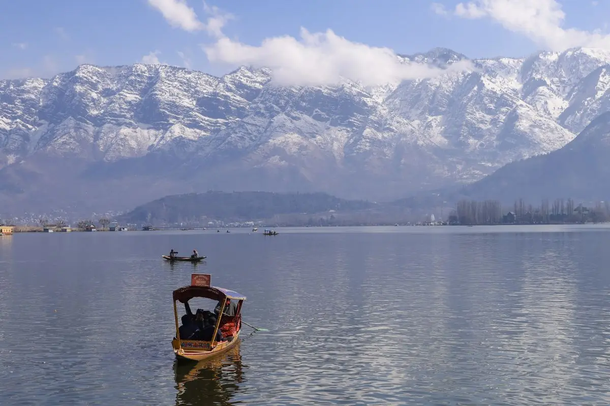 Shikaras on Dal Lake with snow-capped mountains, Srinagar
