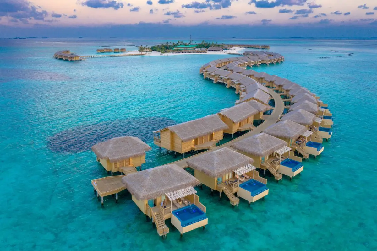 Water villas in the Maldives at sunset